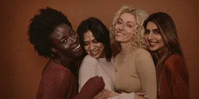 Group of cheerful young women standing together